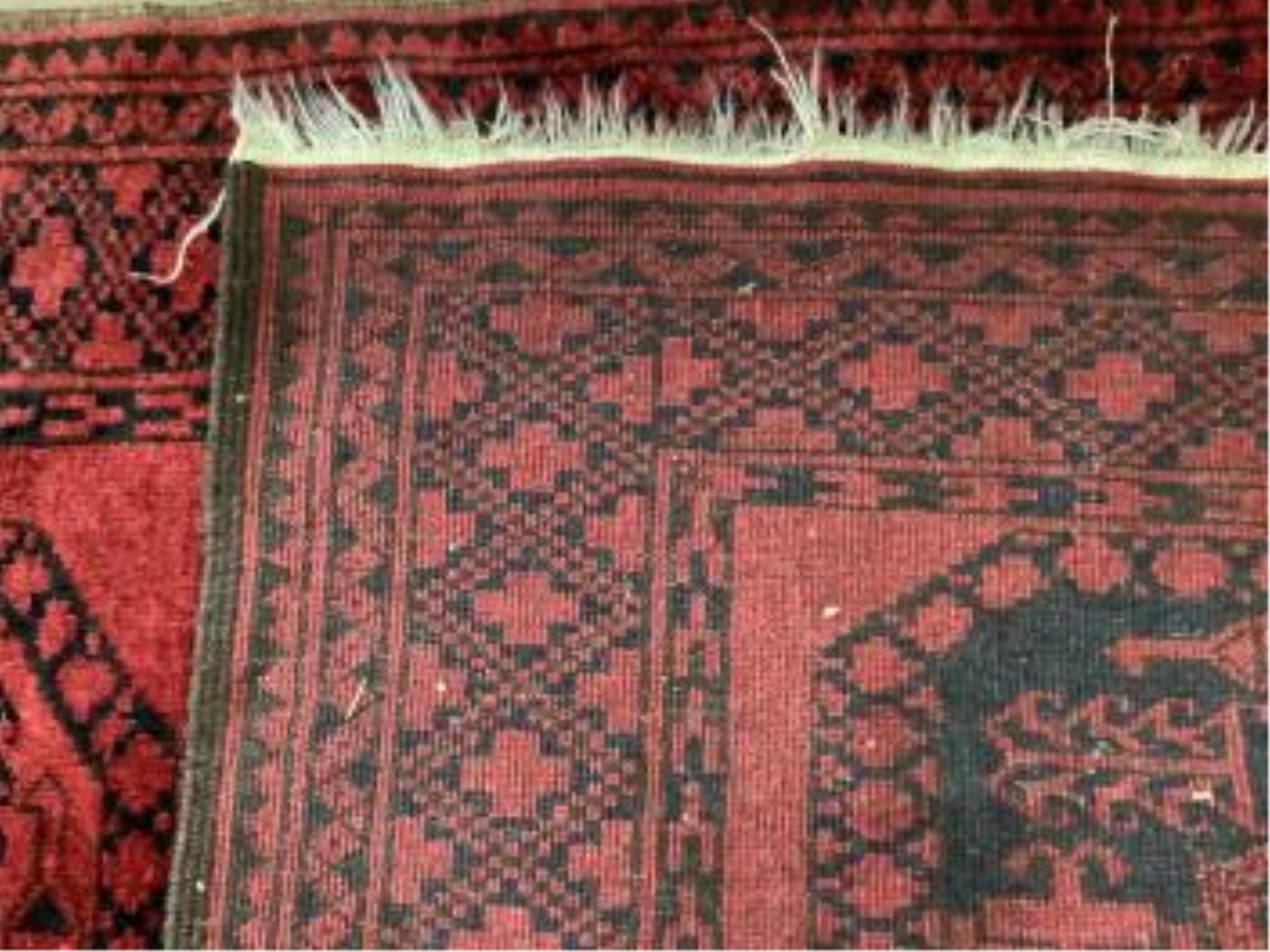 Two Afghan red ground rugs, largest 170 x 120cm. Condition - fair